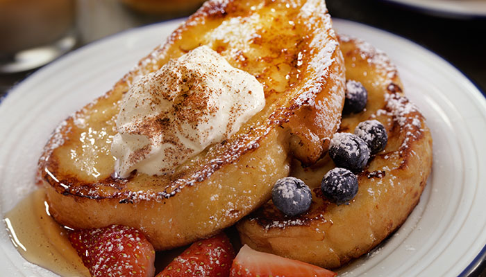 French Toast with Maple Syrup, Berries Whip Cream and Cinnamon